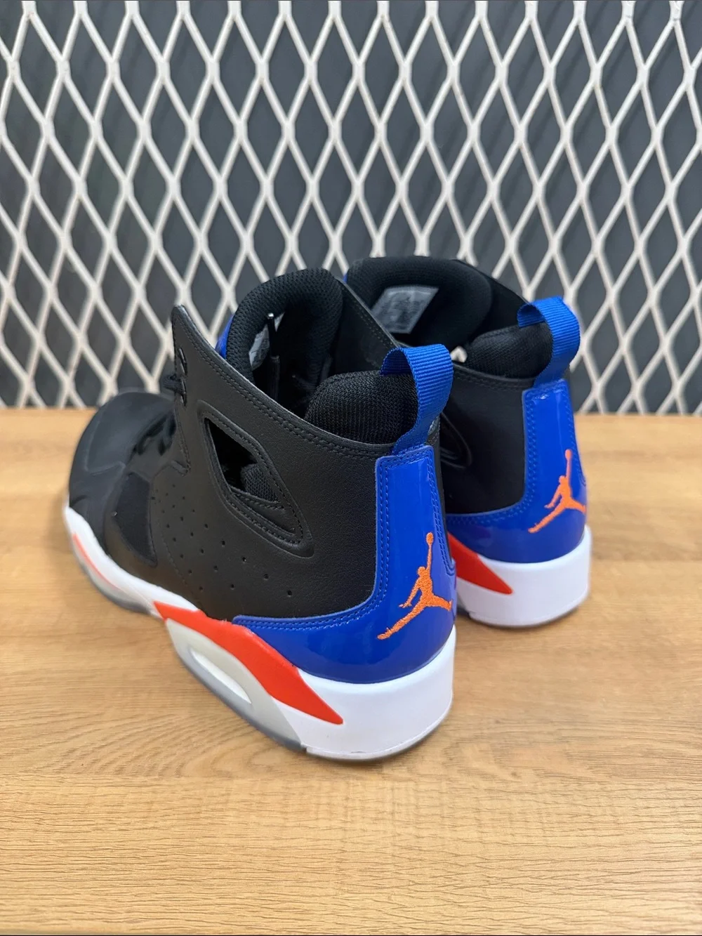 Jordan High-Top Sneakers in Black with Blue and Red Accents